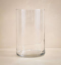 Clear glass vase on a beige background