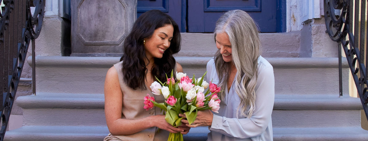 Daughter gifting her mom UrbanStems flowers for Mothers Day