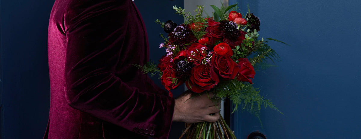 Man bringing Valentine's day flowers to the door