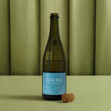 Wine bottle with 'Avaline' label on a green background