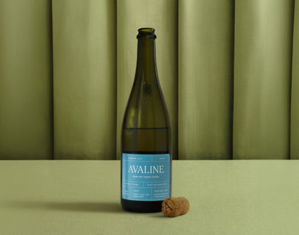 Wine bottle with 'Avaline' label on a green background
